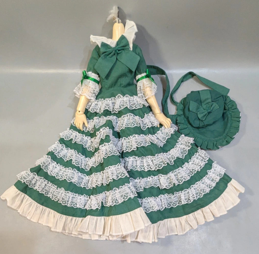 Doll outfit: Loose fit and long length for MSD; too small for SD (but gets stuck at the bottom). Antique green dress.