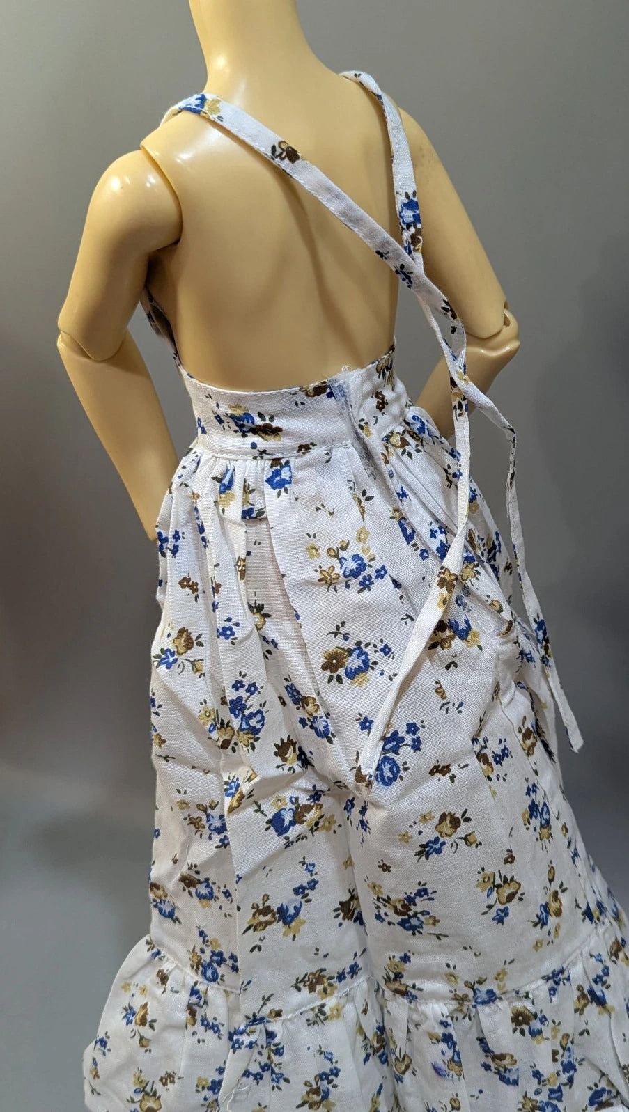 Doll outfit, SD/DD size, halter neck dress, white with floral pattern.
