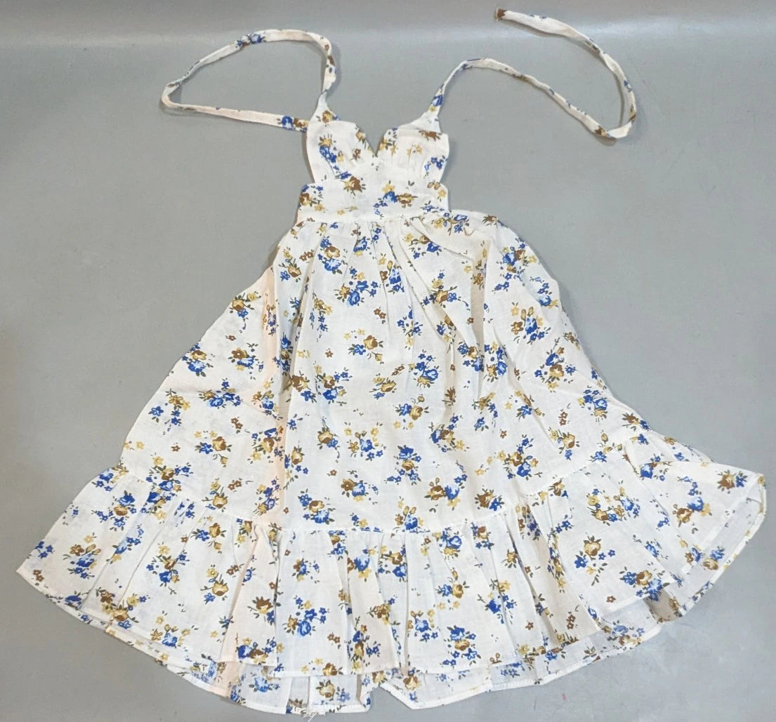 Doll outfit, SD/DD size, halter neck dress, white with floral pattern.