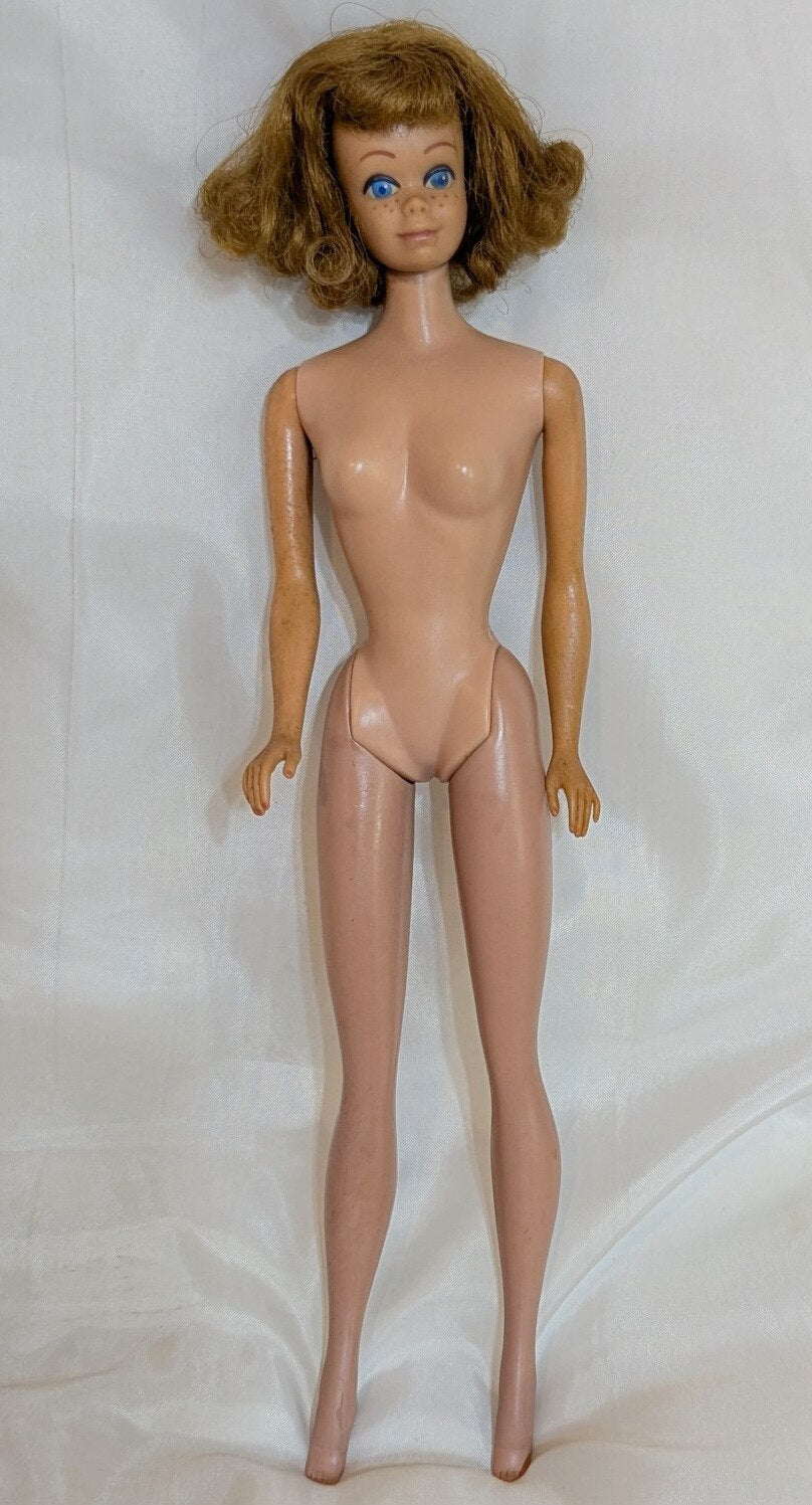 Mattel Vintage Barbie Midge, with freckles/closed mouth, red hair, pink dress.