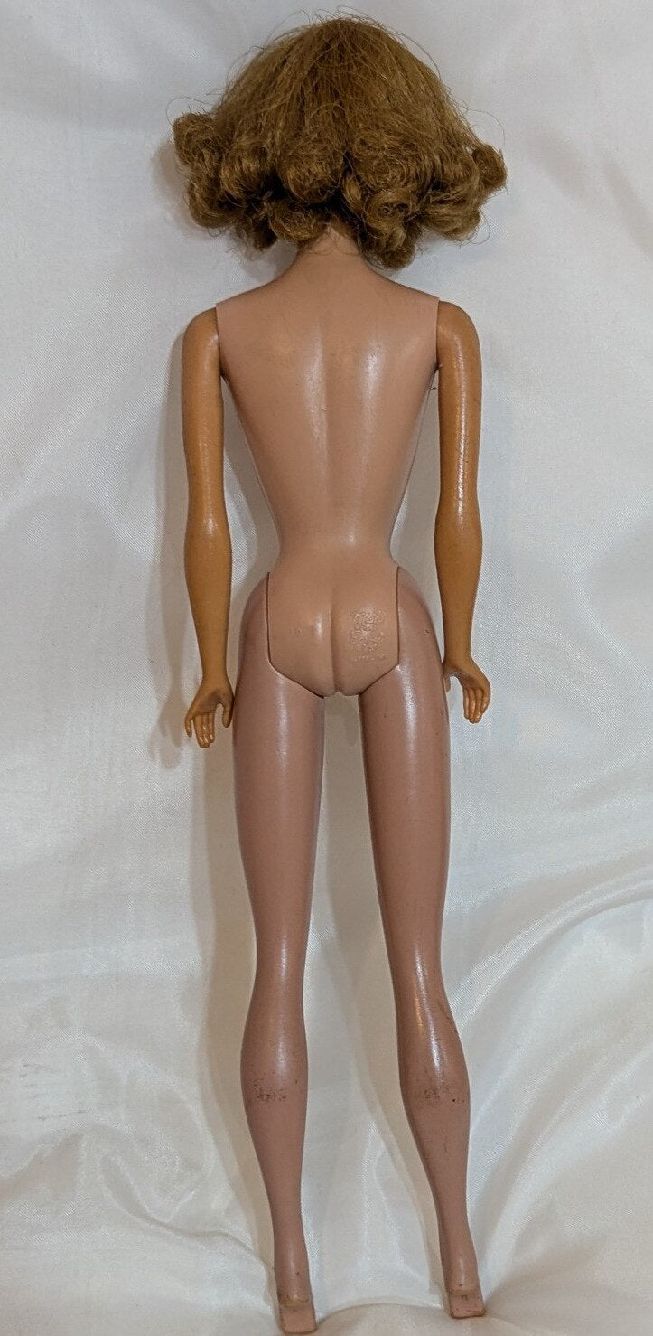 Mattel Vintage Barbie Midge, with freckles/closed mouth, red hair, pink dress.