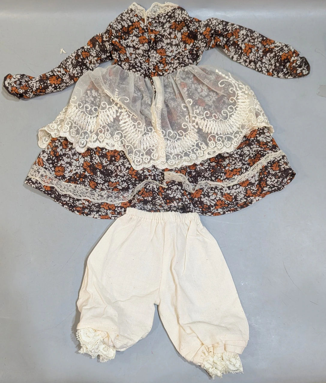 Doll outfit, SD size, apron dress, floral pattern, black.