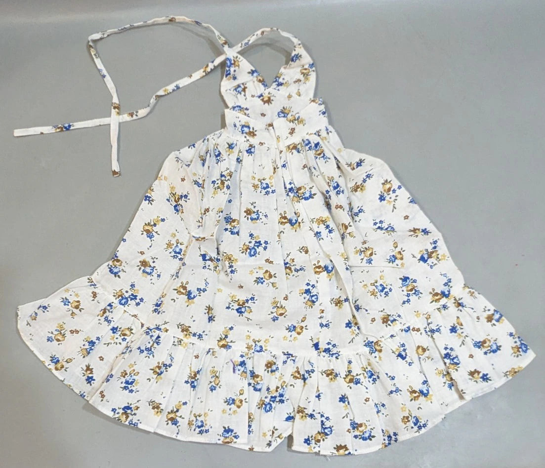 Doll outfit, SD/DD size, halter neck dress, white with floral pattern.